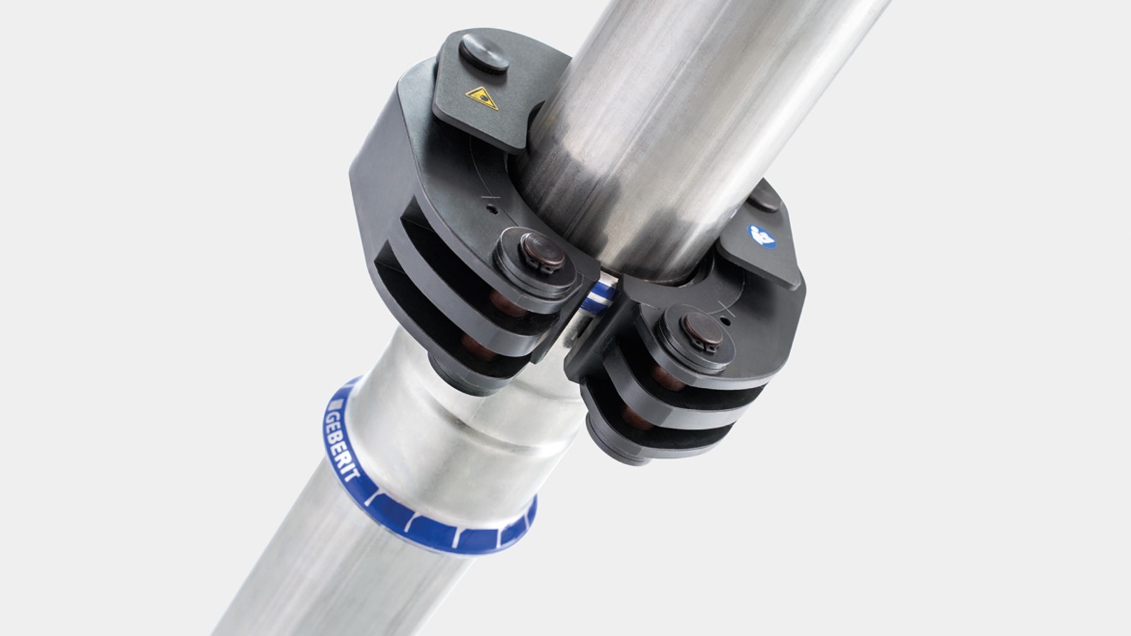 Zaustavni mehanizam fiksira Geberit obujmicu za stiskanje na Geberit Mapress spojnom elementu